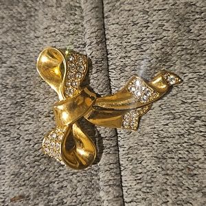 Gold colored brooch